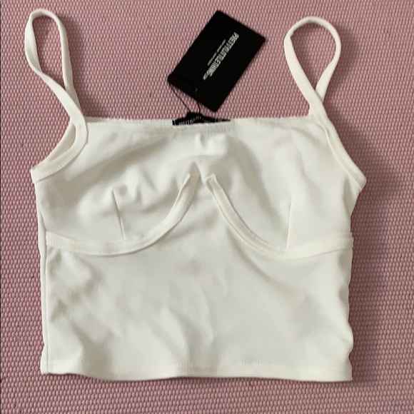 PrettyLittleThing Tops - Cream bustier detail crop top